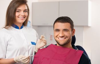 man in a dental chair during a dental appointment