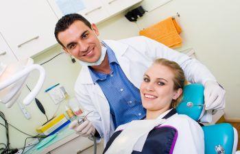 woman in a dental chair undergoing dental procedure