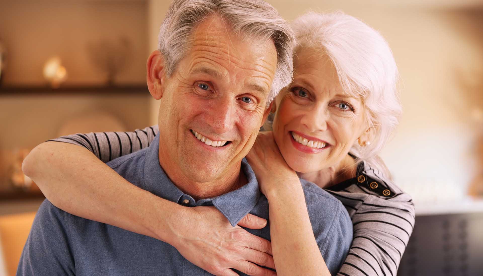 happy senior couple with perfect smiles