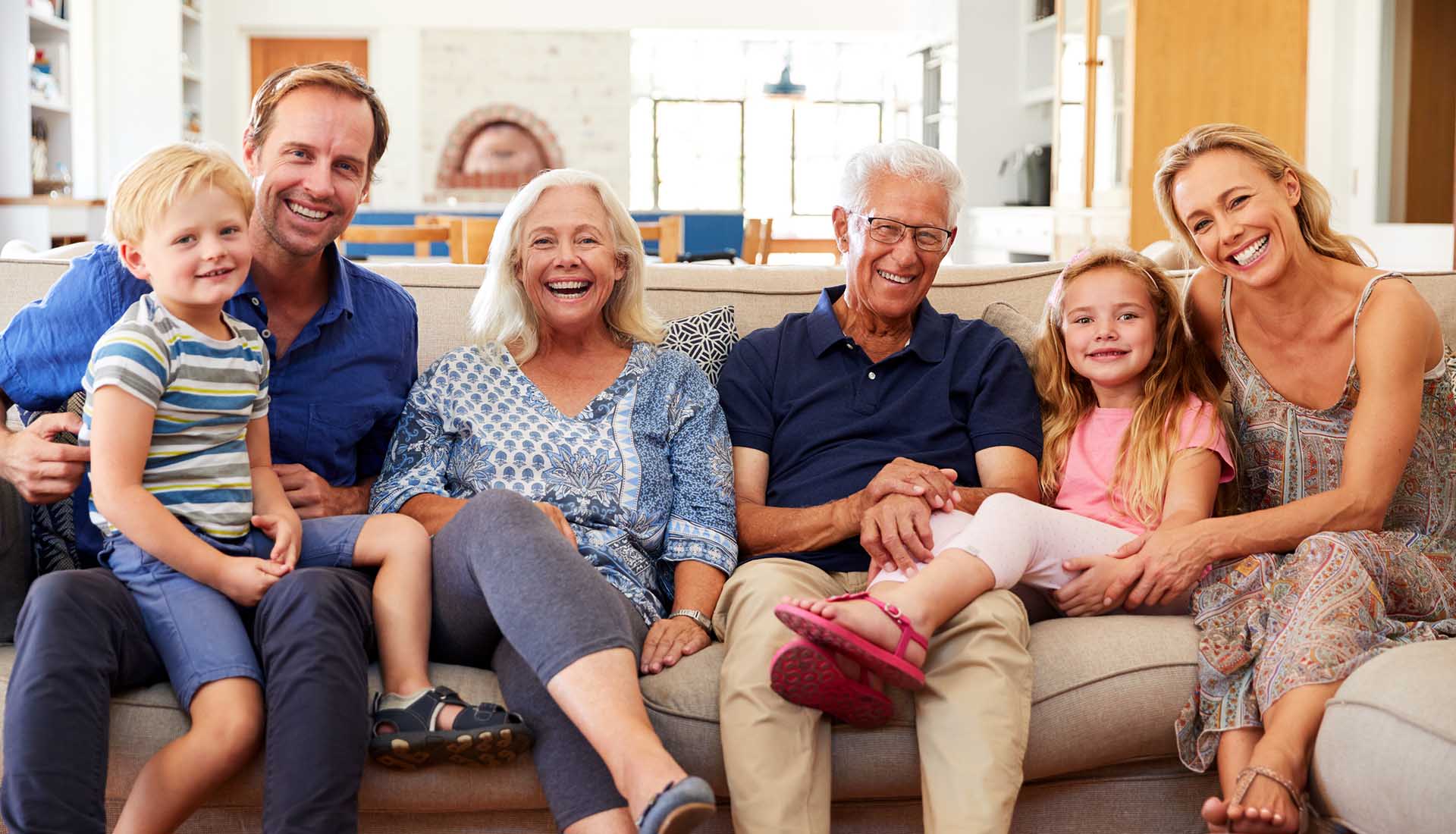 happy three-generation family enjoying time together at home