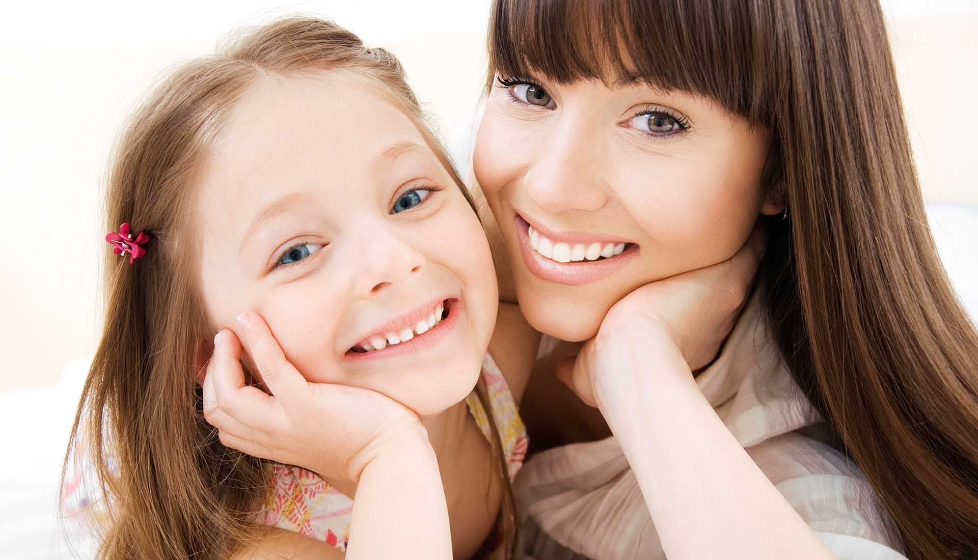 Happy smiling mother and daughter