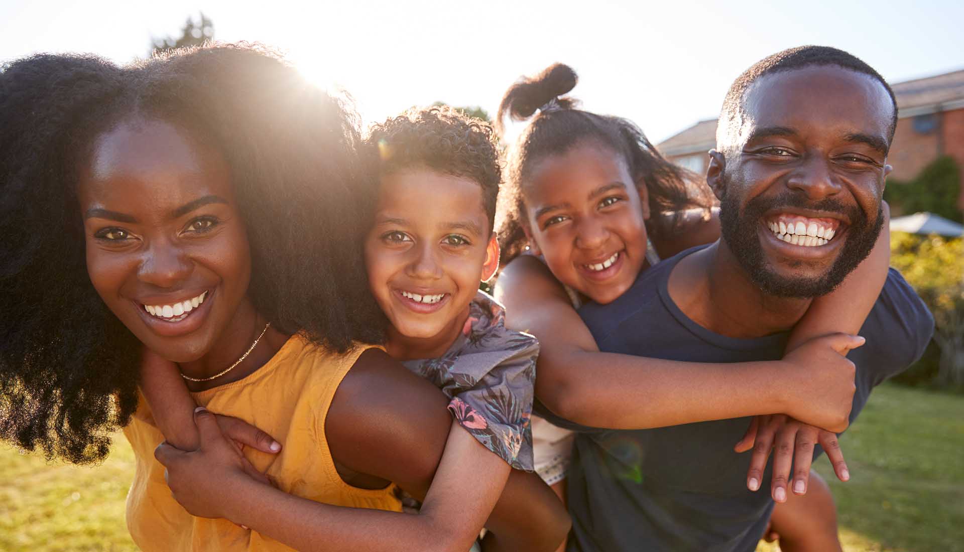 happy Afro-American family : parents with their daughter and son