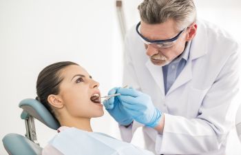 Woman undergoing dental checkup