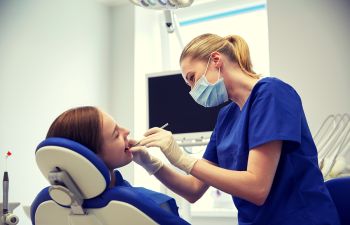 Dental Patient and Assistant